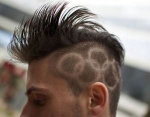 Man featuring Olympic rings in his hair in Sochi prior to Sochi 2014 Olympics